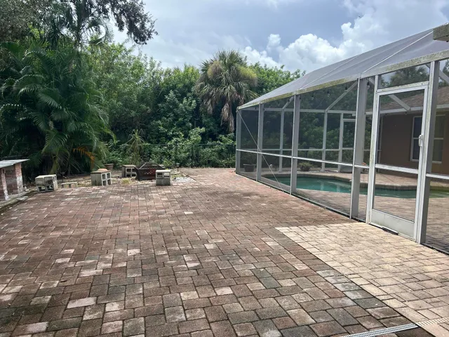 a view of a couches in backyard of house
