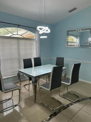 a view of a dining room with furniture