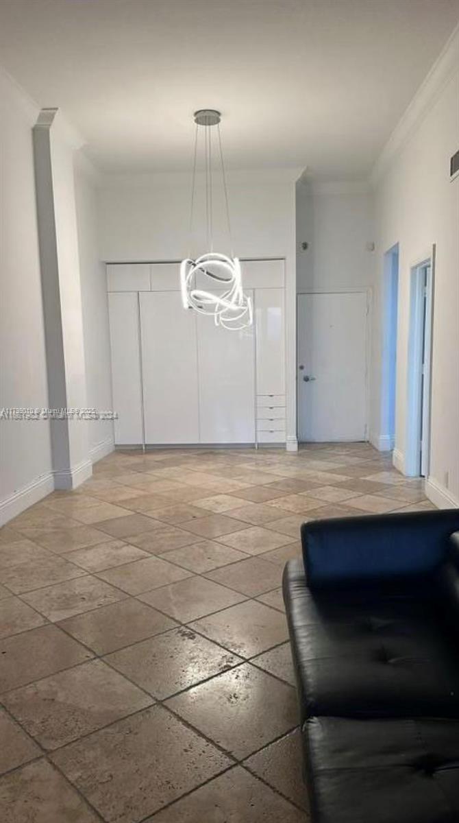 6770 Indian Creek Drive, Unit TSB Miami Beach, FL 33141 - Photo 3 of 12 a room with a table and chairs