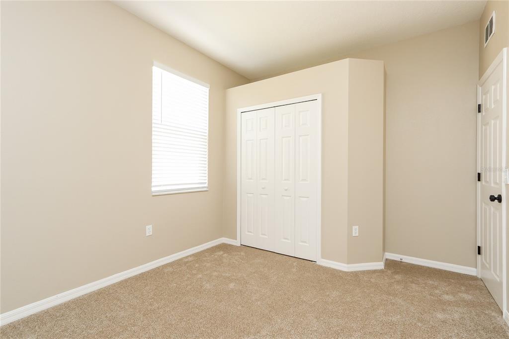 6239 Blue Runner Court Lakewood Ranch, FL 34202 - Photo 11 of 15 an empty room with windows