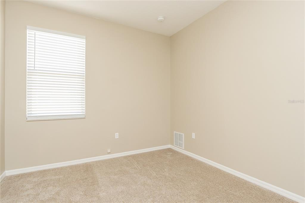 6239 Blue Runner Court Lakewood Ranch, FL 34202 - Photo 12 of 15 an empty room with a window