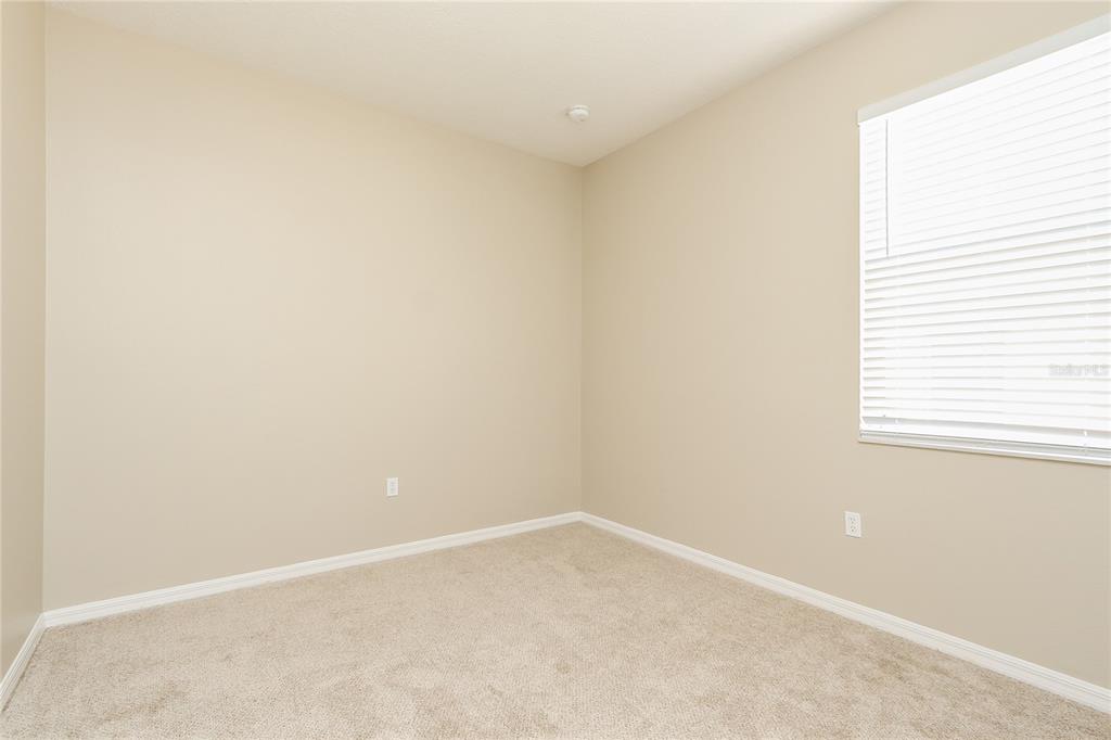 6239 Blue Runner Court Lakewood Ranch, FL 34202 - Photo 3 of 15 an empty room with a window