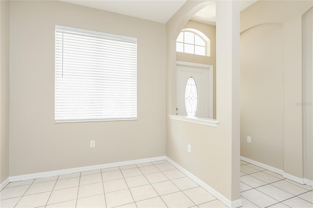 6239 Blue Runner Court Lakewood Ranch, FL 34202 - Photo 4 of 15 an empty room that has a window in it