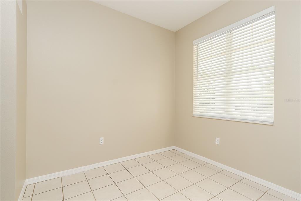 6239 Blue Runner Court Lakewood Ranch, FL 34202 - Photo 5 of 15 an empty room with a window