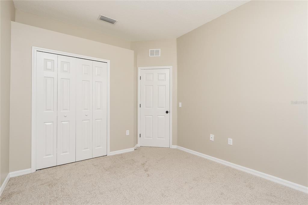 6239 Blue Runner Court Lakewood Ranch, FL 34202 - Photo 8 of 15 a view of an empty room