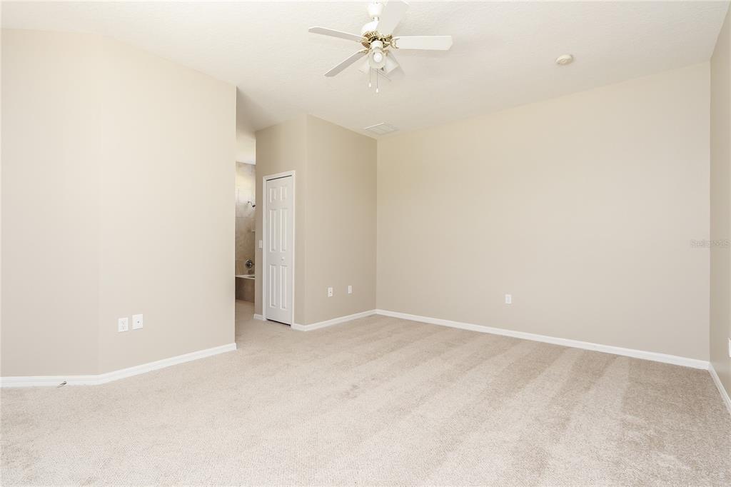 6239 Blue Runner Court Lakewood Ranch, FL 34202 - Photo 9 of 15 an empty room with a ceiling fan and a window