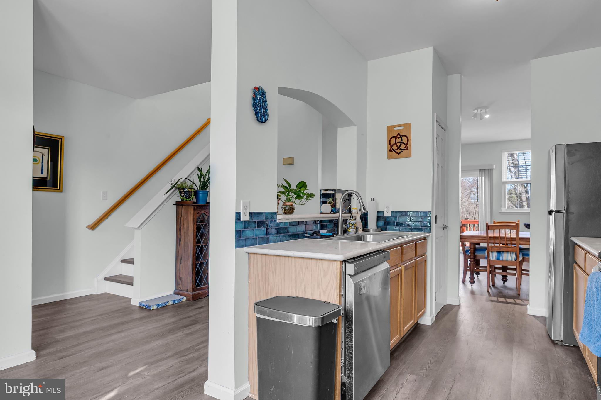 43 Wicklow Road Bear, DE 19701 - Photo 18 of 37 a kitchen with stainless steel appliances granite countertop a sink stove and wooden floor