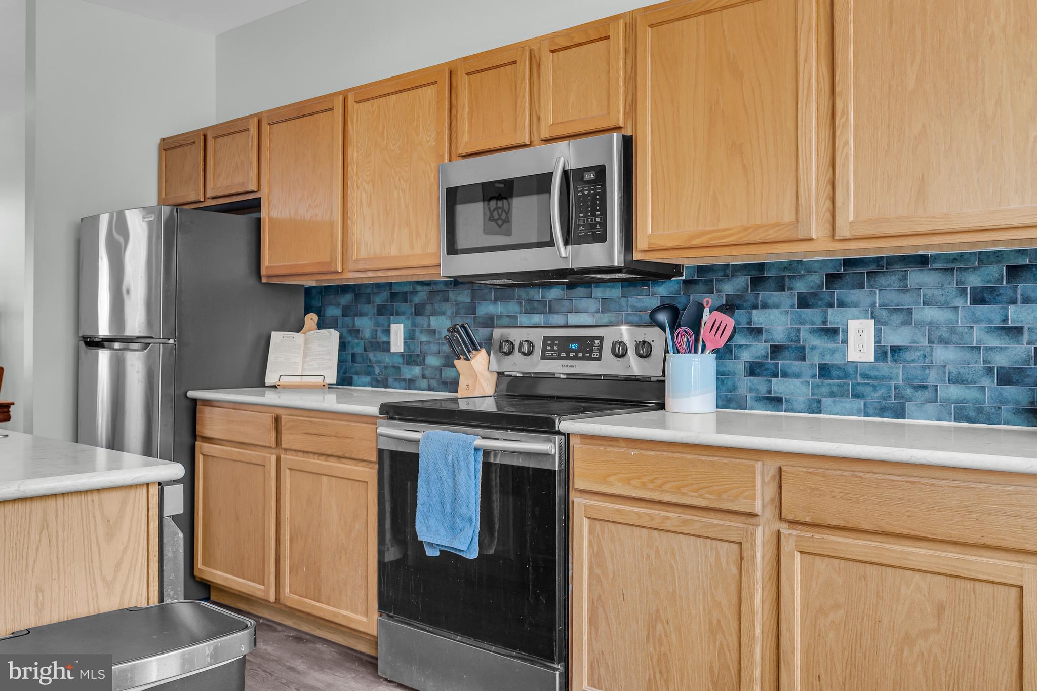 43 Wicklow Road Bear, DE 19701 - Photo 20 of 37 a kitchen with stainless steel appliances granite countertop a sink stove and microwave