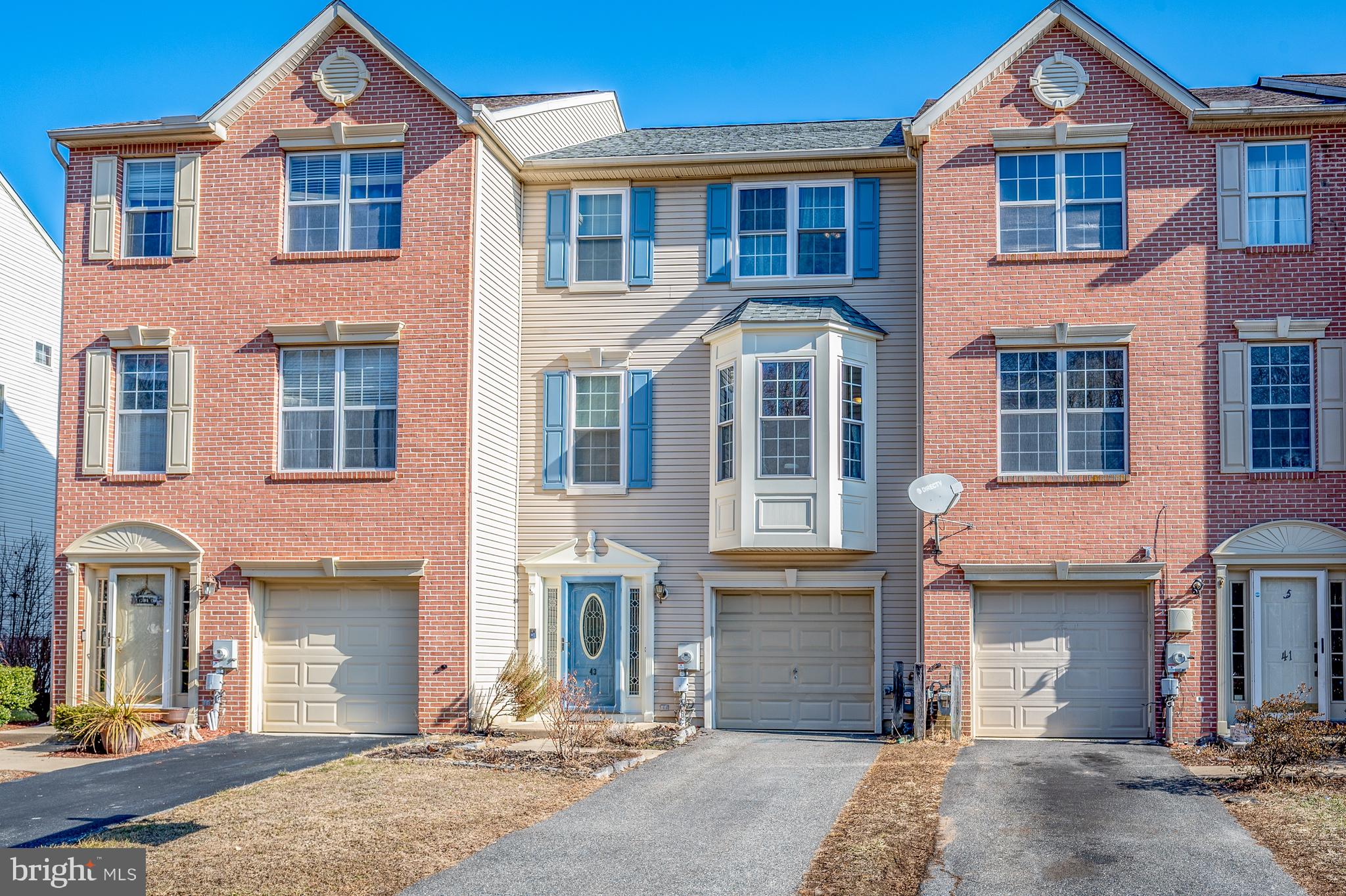 43 Wicklow Road Bear, DE 19701 - Photo 2 of 37 a front view of a house with a yard and parking