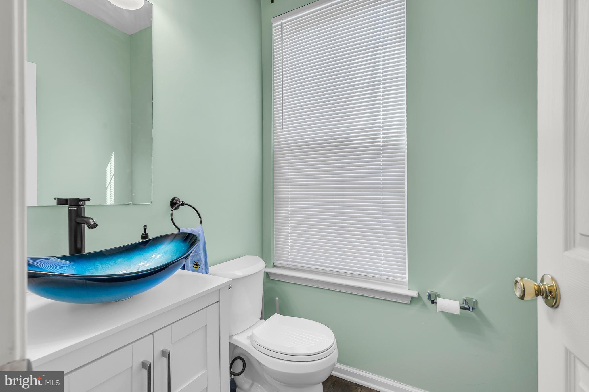 43 Wicklow Road Bear, DE 19701 - Photo 21 of 37 a bathroom with a granite countertop sink toilet and a mirror