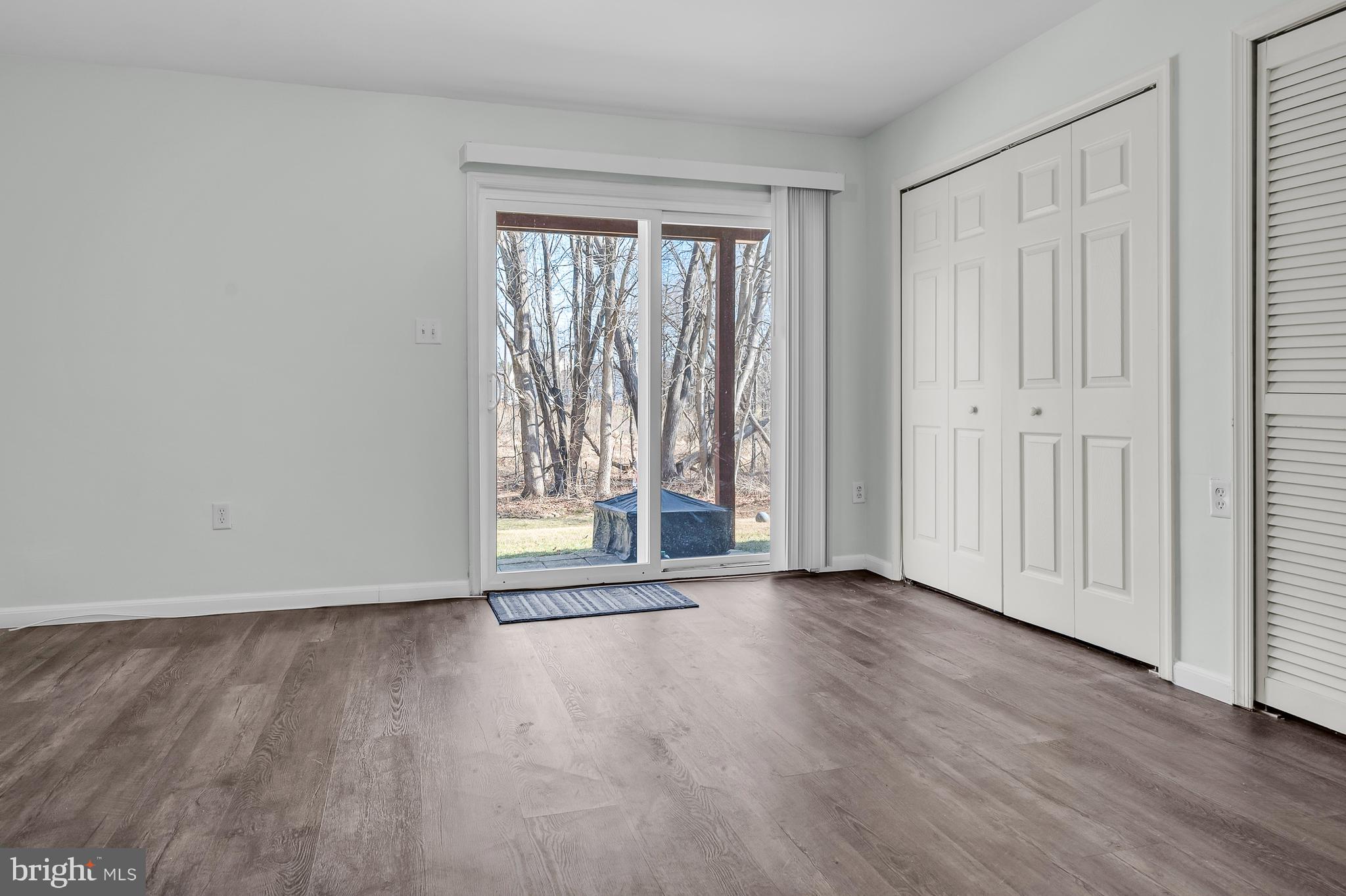 43 Wicklow Road Bear, DE 19701 - Photo 8 of 37 a view of an empty room with wooden floor and a window