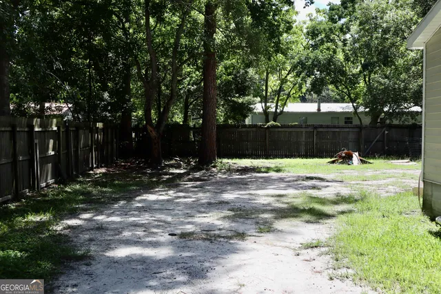 a view of swimming pool with a patio