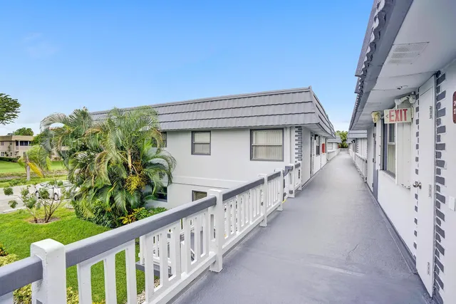 a view of a house with wooden stairs