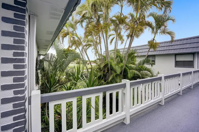 a view of a balcony with plants
