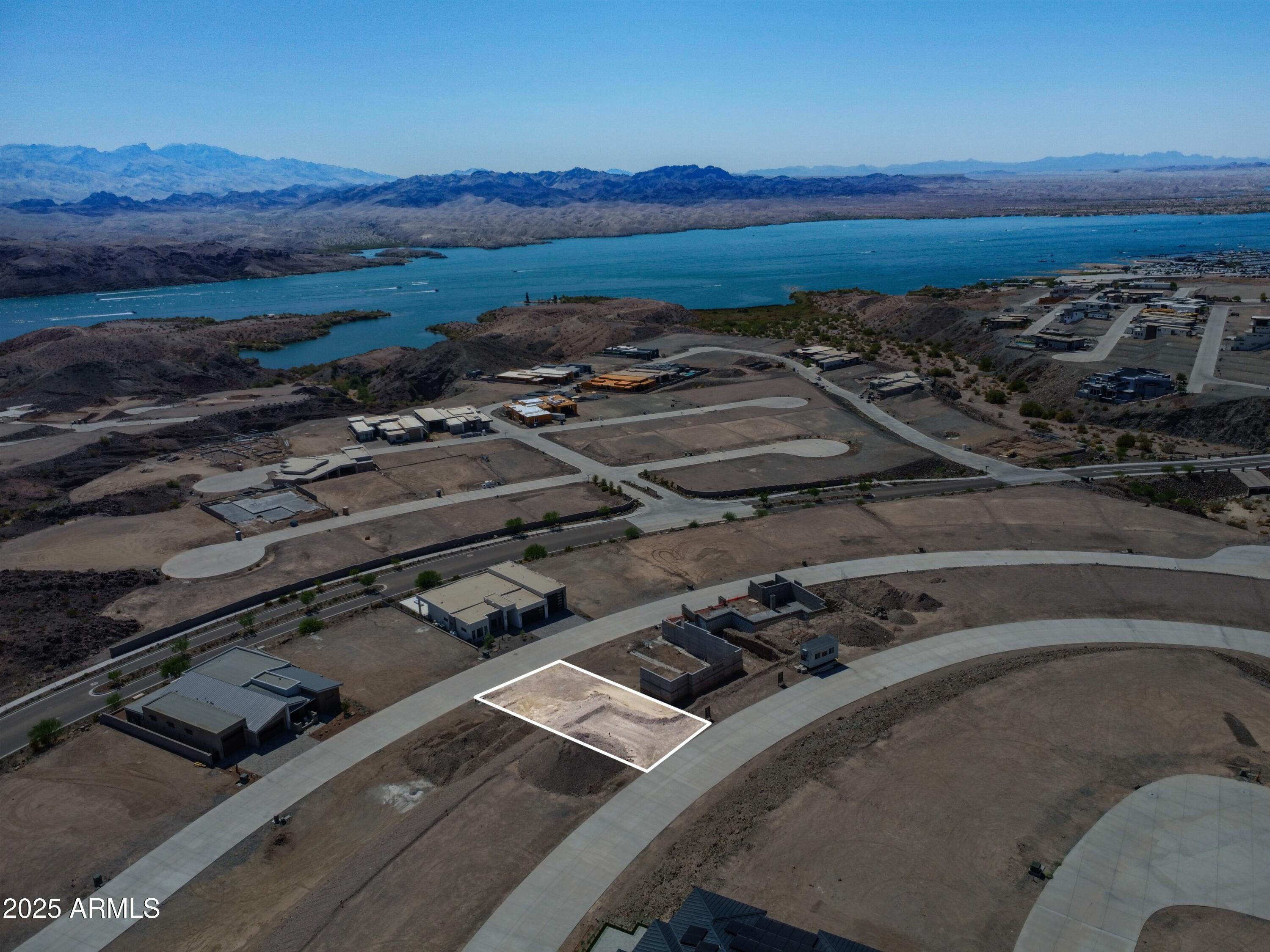 2408 Desert Ridge West, Unit 20 Lake Havasu City, AZ 86406 - Photo 5 of 9 a view of a backyard of a house with a yard
