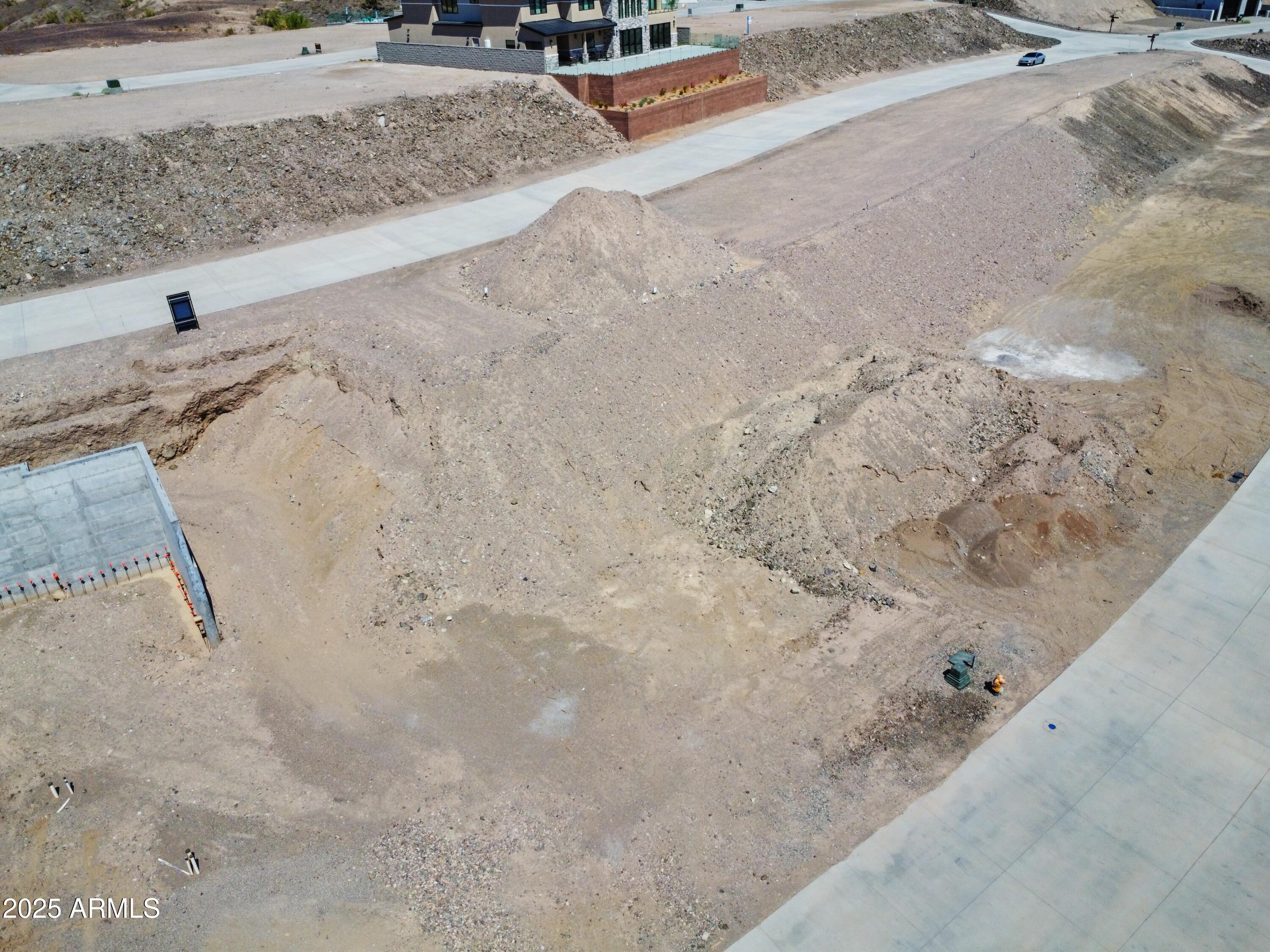 2408 Desert Ridge West, Unit 20 Lake Havasu City, AZ 86406 - Photo 8 of 9 a view of a dry yard with wooden fence
