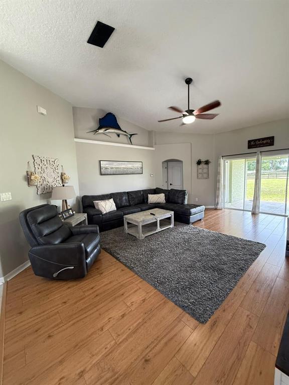 41430 Roger Giles Road Umatilla, FL 32784 - Photo 18 of 27 a living room with furniture and a rug