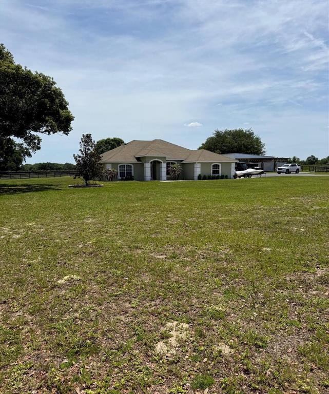41430 Roger Giles Road Umatilla, FL 32784 - Photo 2 of 27 a house with a garden