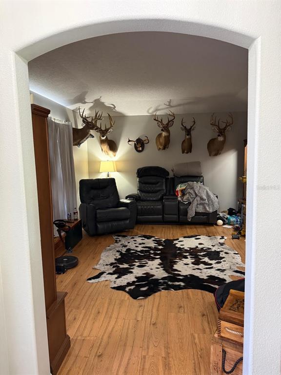 41430 Roger Giles Road Umatilla, FL 32784 - Photo 22 of 27 a bed sitting in a bedroom next to a window