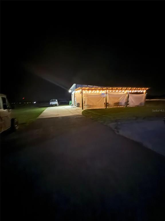 41430 Roger Giles Road Umatilla, FL 32784 - Photo 27 of 27 a view of an ocean and a yard