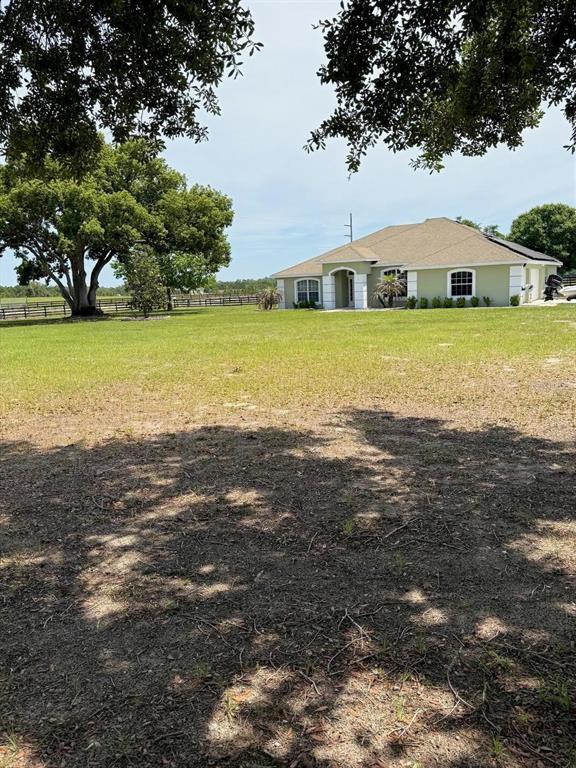 41430 Roger Giles Road Umatilla, FL 32784 - Photo 3 of 27 a view of a lake with houses