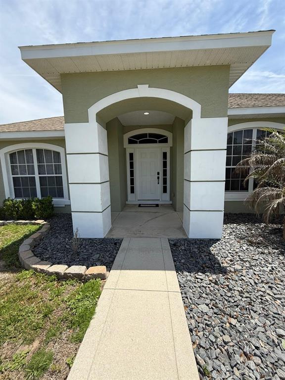 41430 Roger Giles Road Umatilla, FL 32784 - Photo 9 of 27 a front view of a house with a rug