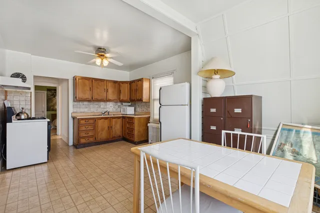 a bed room with a bed and a chandelier