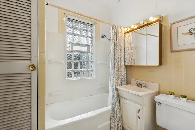 a bathroom with a bathtub sink and toilet