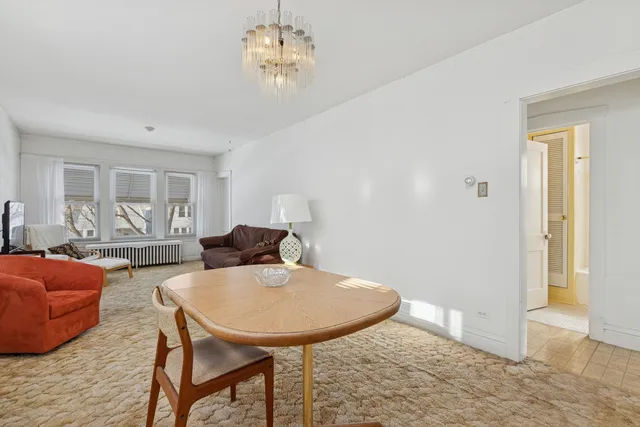a view of a livingroom with furniture and a table