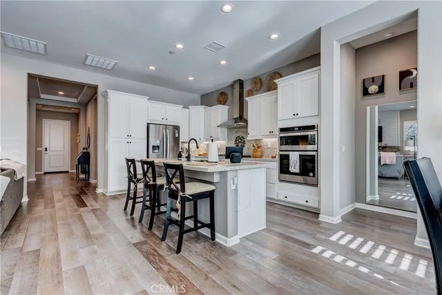 a bathroom with double vanity sink a mirror and a shower