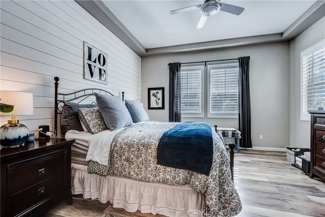 a living room with furniture a table and a large window