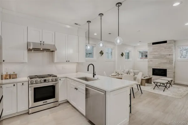 a view of a kitchen with appliances and cabinets
