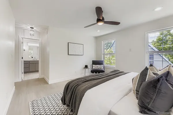a bedroom with a bed and a couch