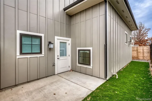 a view of house with backyard of house