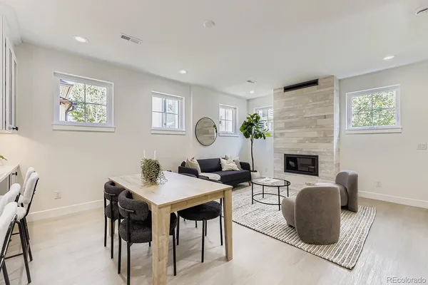 a view of a livingroom with furniture and a fireplace