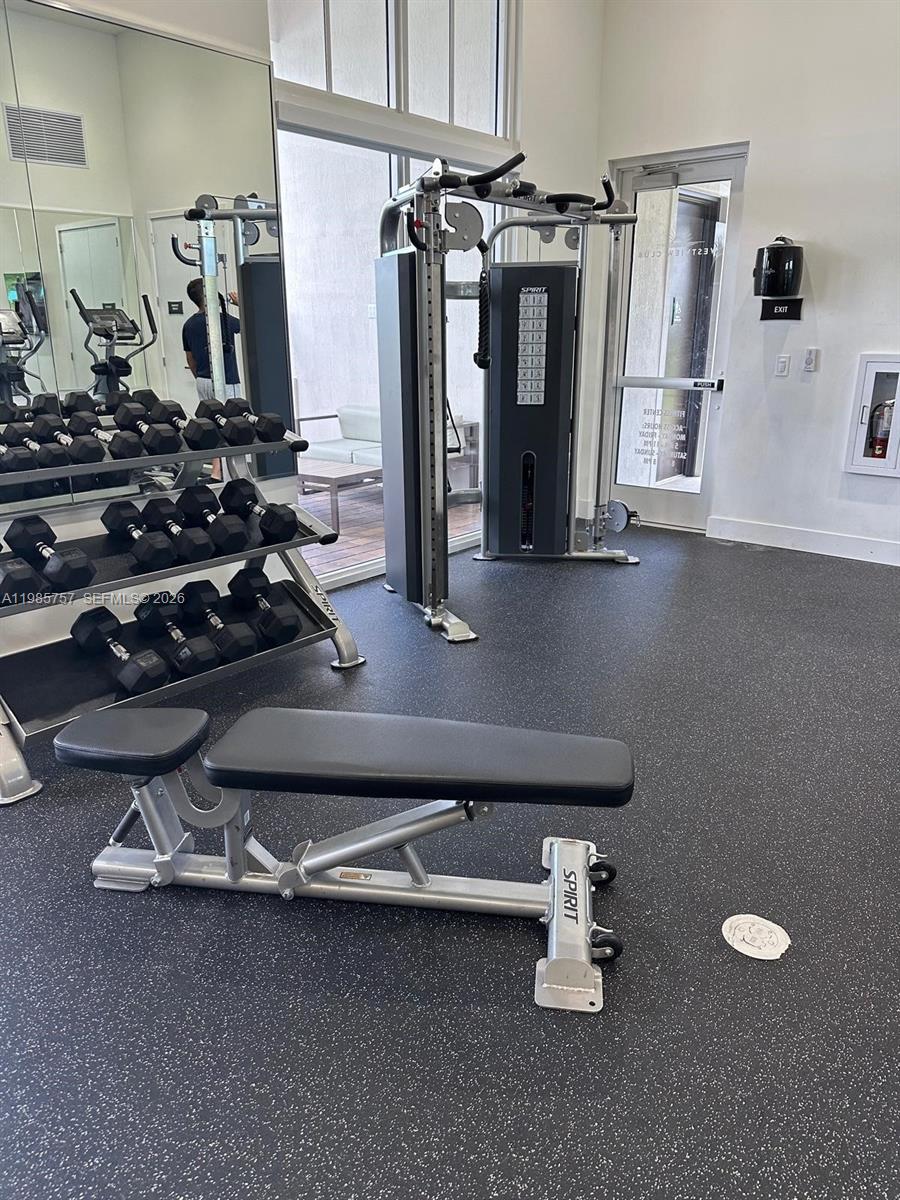12221 Northwest 23rd Place Miami, FL 33167 - Photo 16 of 17 a room with gym equipment