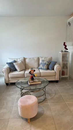 a living room with furniture and a couch
