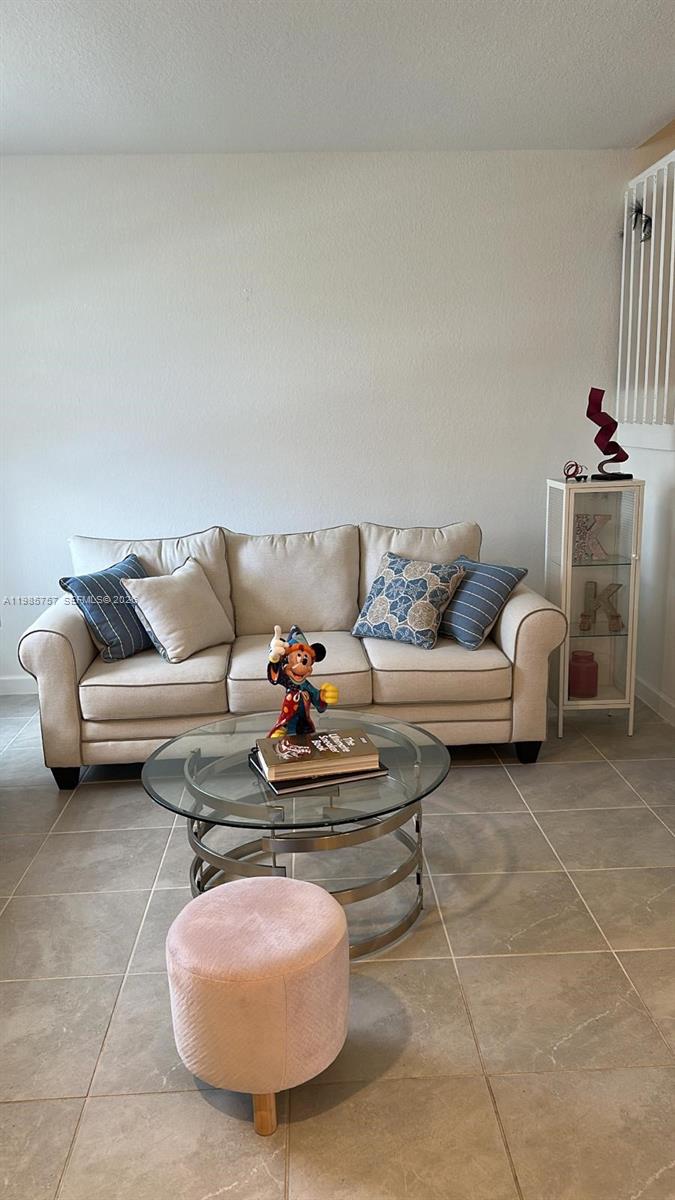 12221 Northwest 23rd Place Miami, FL 33167 - Photo 3 of 17 a living room with furniture and a couch