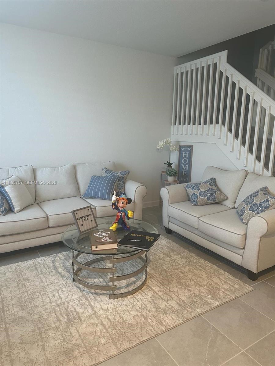 12221 Northwest 23rd Place Miami, FL 33167 - Photo 6 of 17 a living room with furniture and a couch