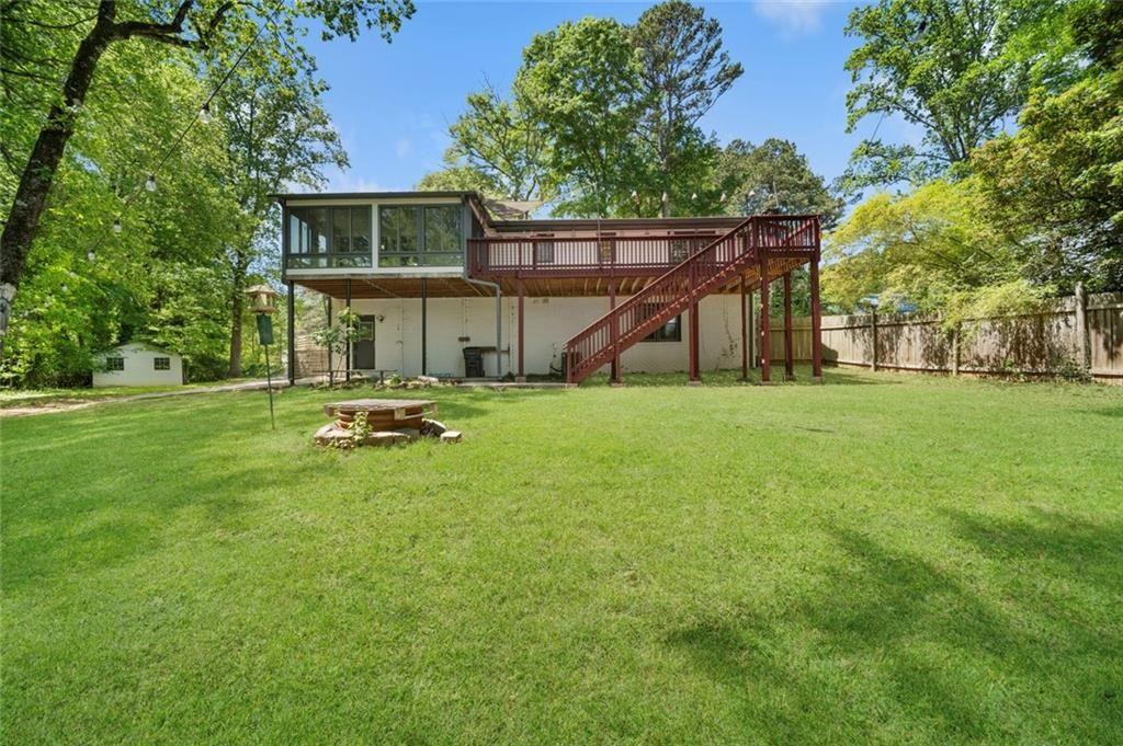 2702 Davenport Road Northwest Duluth, GA 30096 - Photo 40 of 48 a view of a house with backyard sitting area and tree