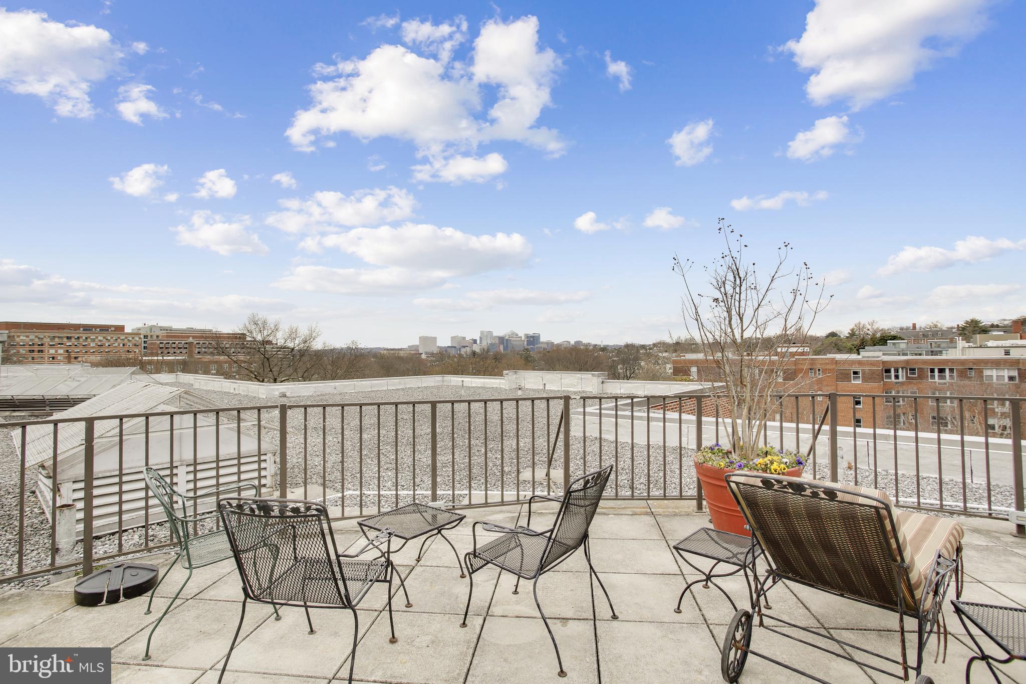 2500 Q Street Northwest, Unit 201 Washington, DC 20007 - Photo 14 of 36 a view of a lake with table and chairs