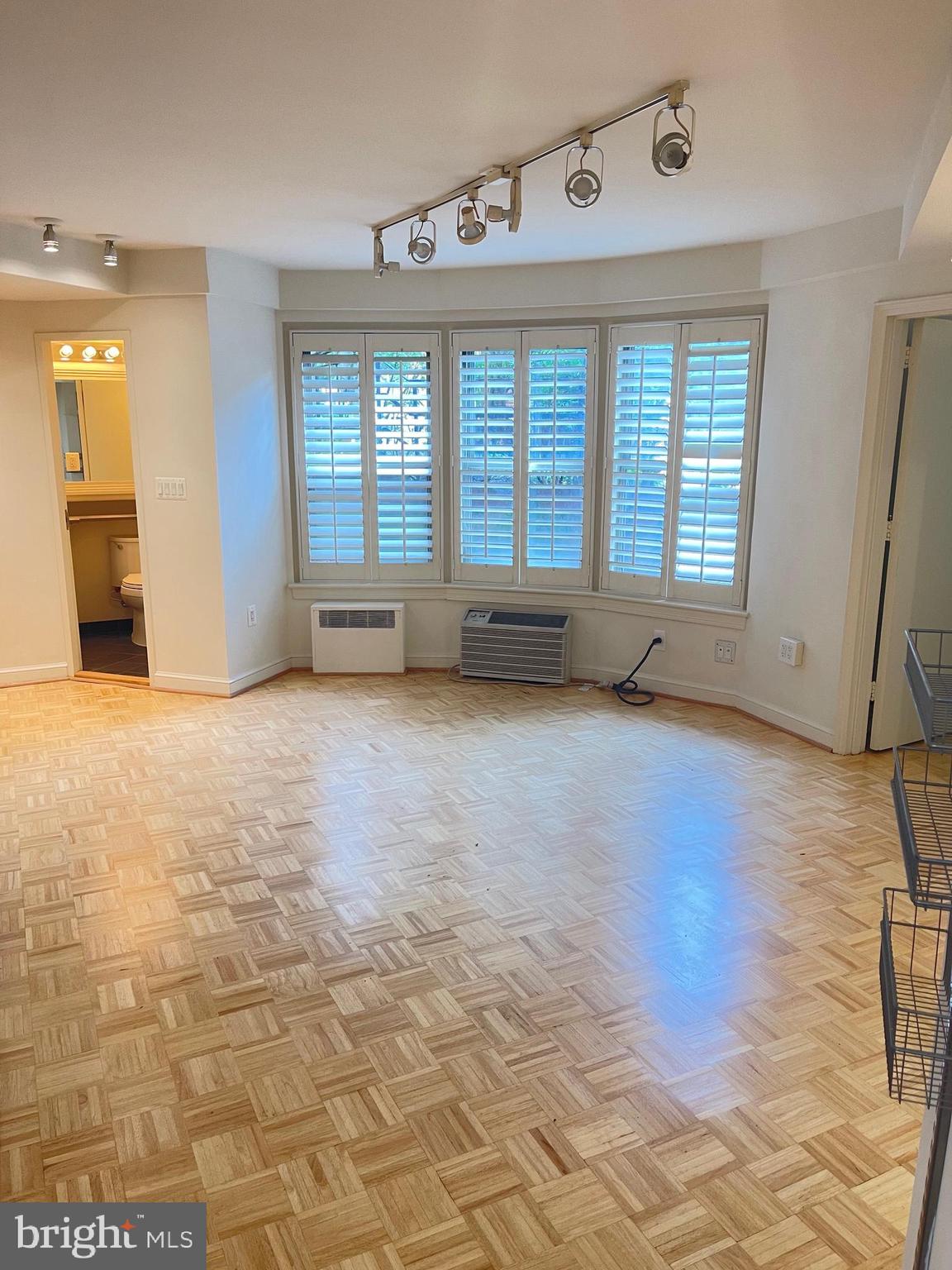 2500 Q Street Northwest, Unit 201 Washington, DC 20007 - Photo 20 of 36 a view of an empty room with glass door