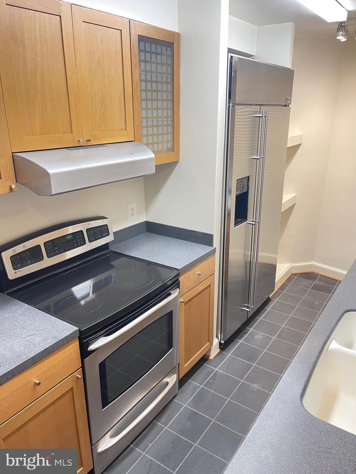 2500 Q Street Northwest, Unit 201 Washington, DC 20007 - Photo 25 of 36 a kitchen with a stove and a microwave