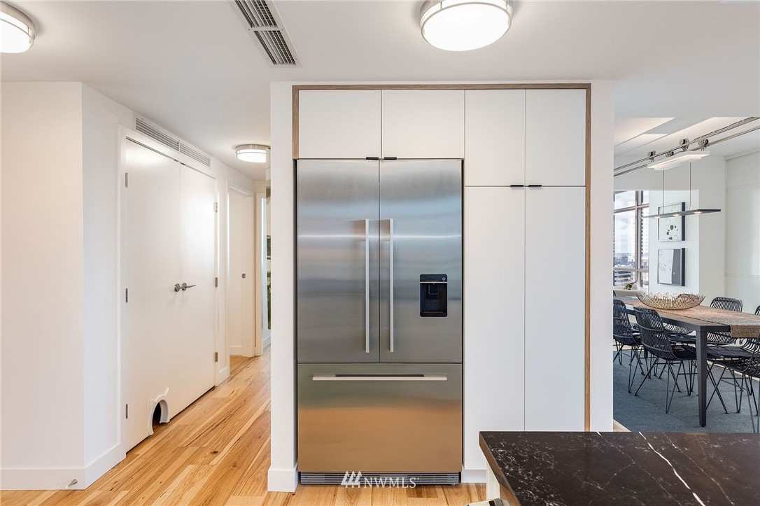 1420 Terry Avenue, Unit 2602 Seattle, WA 98101 - Photo 18 of 40 a view of a kitchen from the hallway
