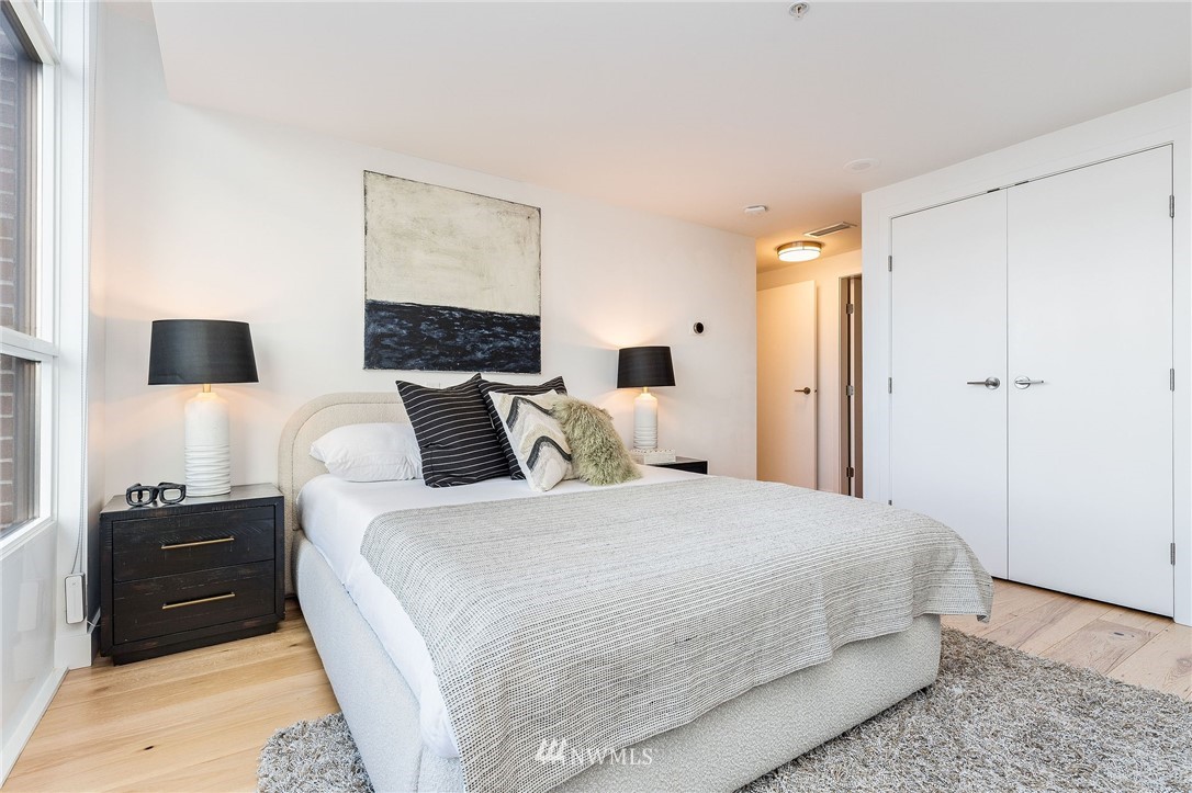 1420 Terry Avenue, Unit 2602 Seattle, WA 98101 - Photo 21 of 40 a bedroom with a bed and a television