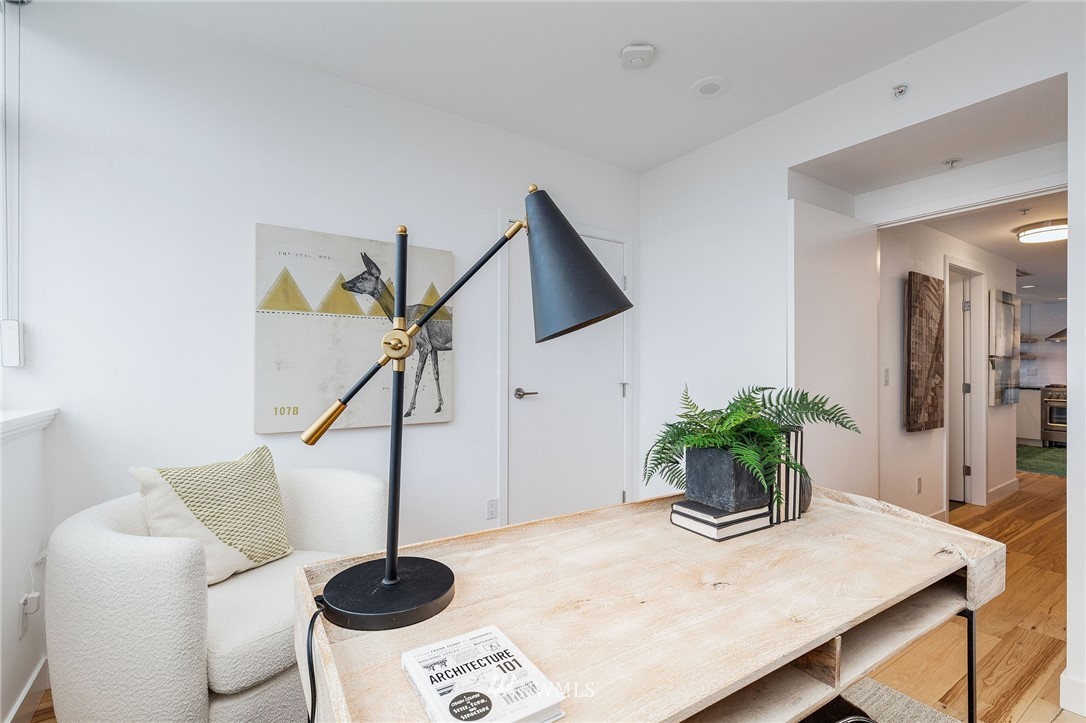 1420 Terry Avenue, Unit 2602 Seattle, WA 98101 - Photo 27 of 40 a living room with furniture and potted plant