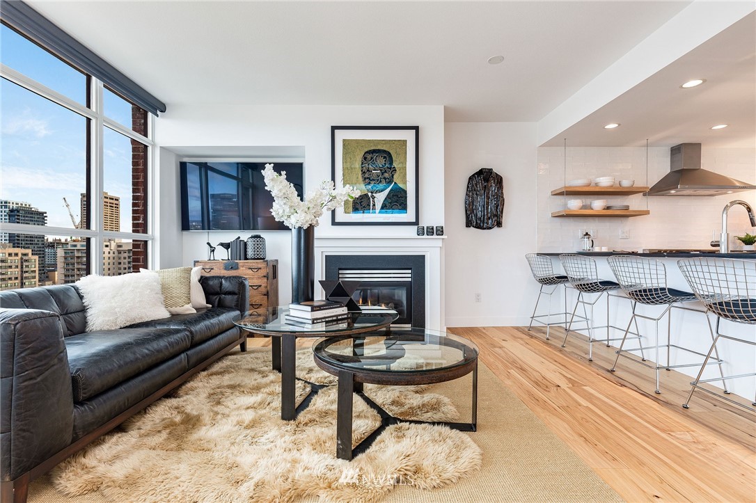 1420 Terry Avenue, Unit 2602 Seattle, WA 98101 - Photo 10 of 40 a living room with furniture and a fireplace