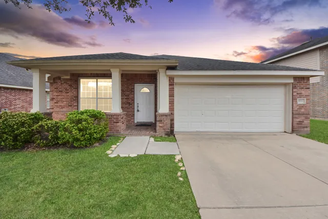 front view of a house with a yard