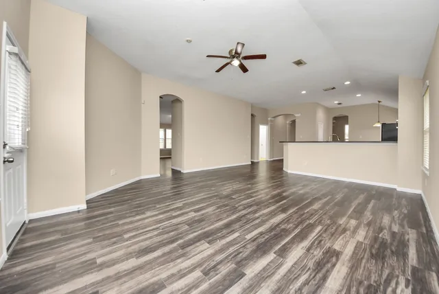 a view of kitchen with cabinets and wooden floor