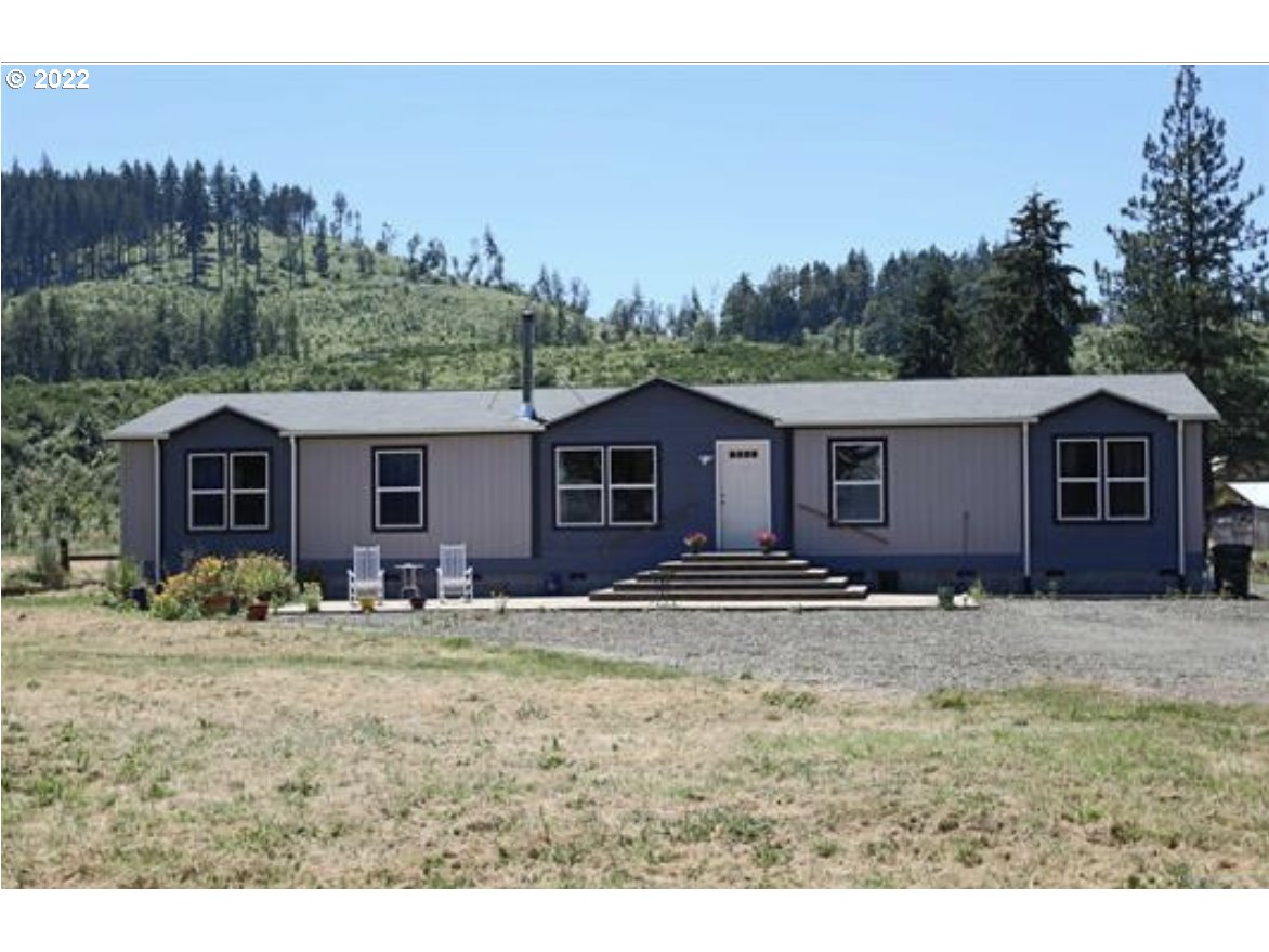 6515 Nonpareil Road Sutherlin, OR 97479 - Photo 1 of 14 a view of a house with a yard